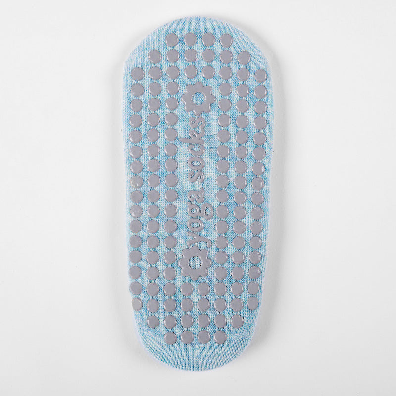 Sole of a blue grip sock with raised grip dots